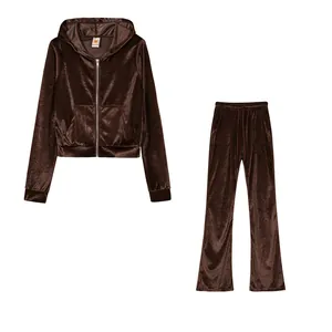 Detail view of a two-piece brown velvet tracksuit set with hoodie and wide-leg pants.