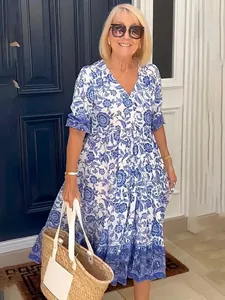 Detailed view of casual blue and white floral maxi dress with elegant tiered skirt design