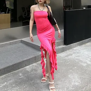 Close-up of bright pink strapless bodycon dress featuring irregular vertical ruffled hem