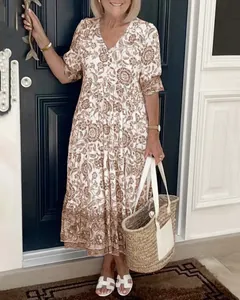 Elegant floral print midi dress with V-neck and tiered skirt, summer boho style.