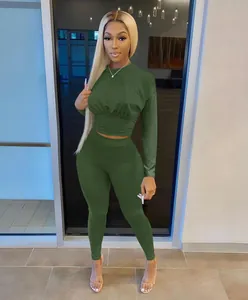 Close-up of olive green two-piece athletic set featuring a waist-cinching cropped top
