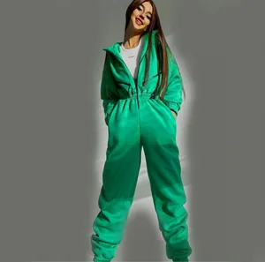 Close-up of a women's vibrant green hooded jumpsuit with front zipper detail