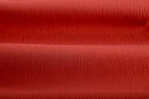 Dettaglio ravvicinato del tessuto rosso stropicciato per set da casa casual da donna elegante