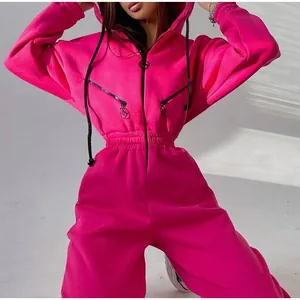 Detail view of hot pink hooded jumpsuit with cinched waist and zipper decor