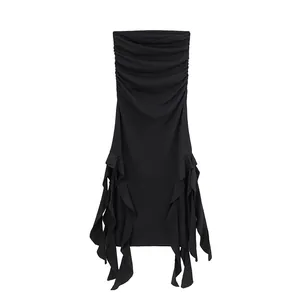 Elegant black strapless tube dress with ruched bodice and irregular ruffled hem.