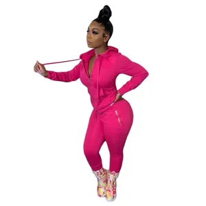 Close-up of hot pink two-piece tracksuit with hoodie and matching joggers