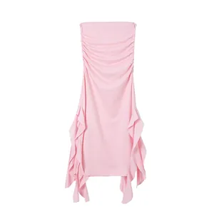 Detailed view of pink strapless bodycon dress with ruched sides and ruffled hem