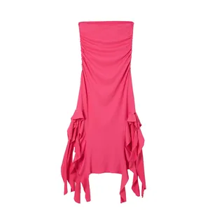 Close-up view of bright pink bodycon dress with asymmetrical ruffled hem detail