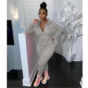 Casual grey two-piece tracksuit set with hooded zip-up top and matching leggings