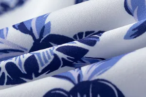 Macro detail of blue and white floral tie-dye pattern on high-quality summer dress fabric