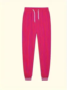 Dettaglio dei pantaloni sportivi rosa acceso con coulisse e polsini a costine