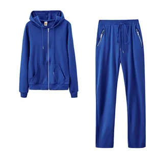 Detailed view of royal blue two-piece women's sports tracksuit with zipper pocket accents
