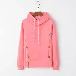 Front view detail of a pink long sleeve hoodie featuring leather-accented pockets