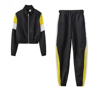 Survêtement de sport 2 pièces pour femmes, design color-block noir, jaune et blanc