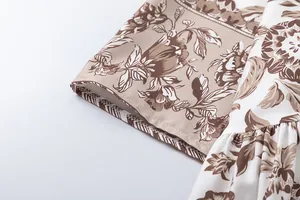 Detailed macro shot of vintage floral print fabric on a summer dress sleeve