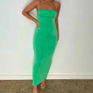 Elegant vibrant green backless halter neck maxi dress featuring a flattering bodycon fit