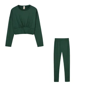 Detailed view of a dark green two-piece loungewear set with cinched waist top.