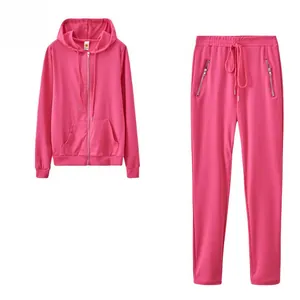Detail view of pink solid color two-piece tracksuit with zipper pockets