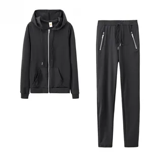 Detailed view of women's black zip-up hoodie and matching joggers tracksuit set