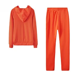 Detailed back view of a vibrant orange two-piece hooded sweatshirt and pants set