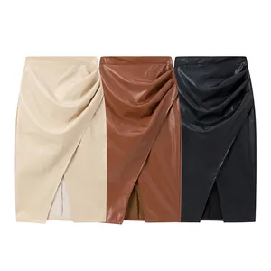Three colors of high-waisted ruched PU leather skirts with asymmetric front slit detail
