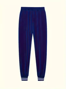 Vista dettagliata dei jogger blu navy iridescenti con vita elastica e polsini a righe
