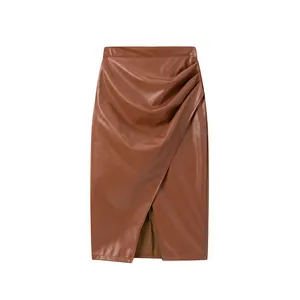 Elegant brown high waist PU leather midi skirt featuring stylish ruching and a front slit