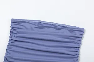 Detailed macro view of lavender ruched fabric showing elegant pleated texture and stitching