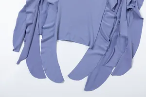 Detailed view of lavender purple slim dress with irregular ruffles and cascading hemline design