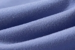 Close-up macro shot of soft lavender purple knitted fabric with fine ribbed texture