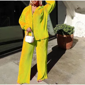 Vibrant neon green pleated two-piece set for women, relaxed fit shirt and wide leg pants
