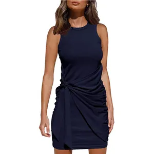 Macro view of sleeveless navy blue mini dress featuring ruched waist and tie-knot detail