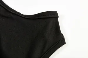 Close-up detail showcasing the premium stitching and fabric texture of a black halter dress