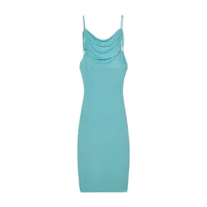 Elegant turquoise cowl neck bodycon mini dress with delicate straps in a studio shot.