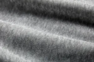 Gedetailleerde macro-opname van de grijze zachte jersey stof voor dames hoodies