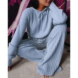 Close-up of women's light blue ribbed knit hooded lounge set with loose wide-leg pants.