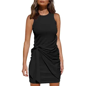 Detail view of black sleeveless dress with ruched tie waist and asymmetrical hem