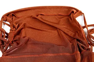 Detailed macro view of the stitching and brown fabric texture of a backless dress