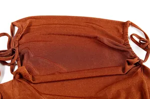 Close-up detail of rust orange ruched neckline with drawstring ties on a summer dress.
