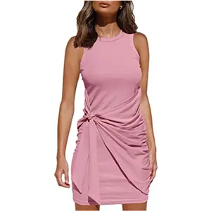 Close-up of pink sleeveless round neck dress with knot tie waist and ruched hem.