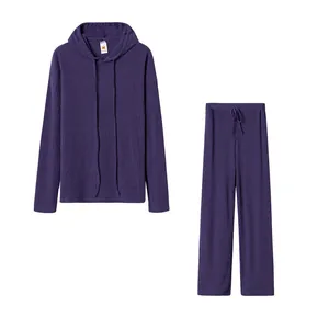 Close-up detail of a purple ribbed two-piece lounge set with hooded top and pants