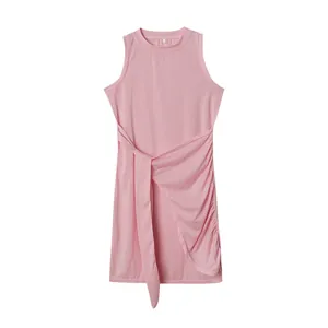 Detailed view of a pink sleeveless dress with waist tie and irregular draped hem