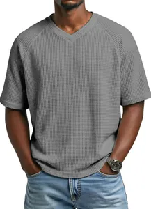 Detailed view of grey waffle knit texture on men's V-neck raglan sleeve t-shirt.