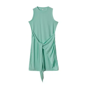 Sleeveless mint green dress with tie-waist and irregular hem detail.