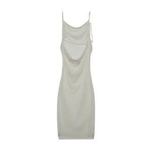 Detailed back view of a white backless sleeveless summer dress with draped cowl neck