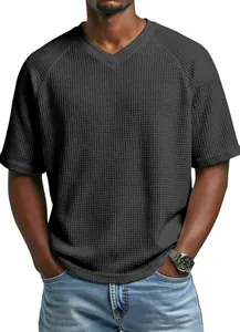 Close-up of men's charcoal waffle knit T-shirt featuring raglan sleeves and V-neck