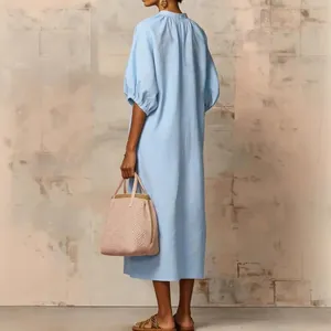 Elegant light blue cotton linen loose midi dress with puff sleeves and casual back view