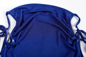 Detailed view of royal blue fabric texture and drawstring ties on a halter dress