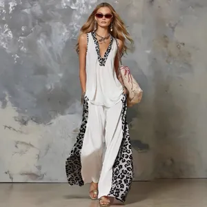 Stylish women's summer white set with leopard print patchwork sleeveless top and pants