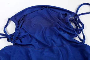 Detailed close-up showing the halter neck and tie-up design of a blue backless maxi dress